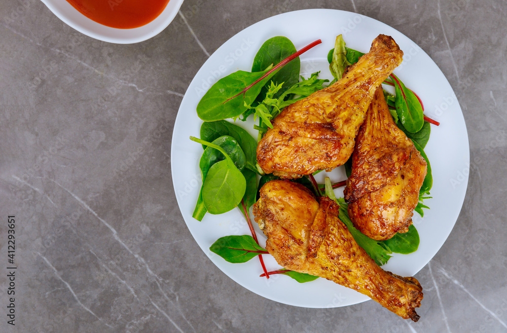 Balanced lunch with grilled chicken and salad. Balanced lunch with grilled chicken and salad.