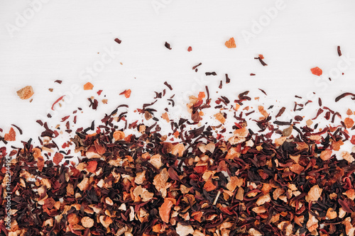 Dry fruit tea randomly scattered on a white table background. Top view. Copy, empty space for text