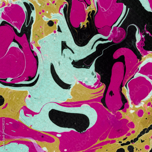 Colorful marble ink texture on watercolor paper background. Marble stone image. Bath bomb effect. Psychedelic biomorphic art.