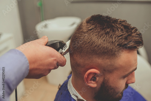 Young Man in Barbershop Hair Care Service ConceptYoung Man in Barbershop Hair Care Service Concept