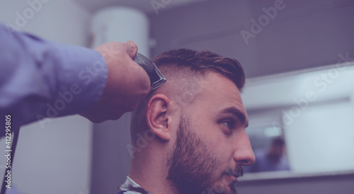 Young Man in Barbershop Hair Care Service ConceptYoung Man in Barbershop Hair Care Service Concept