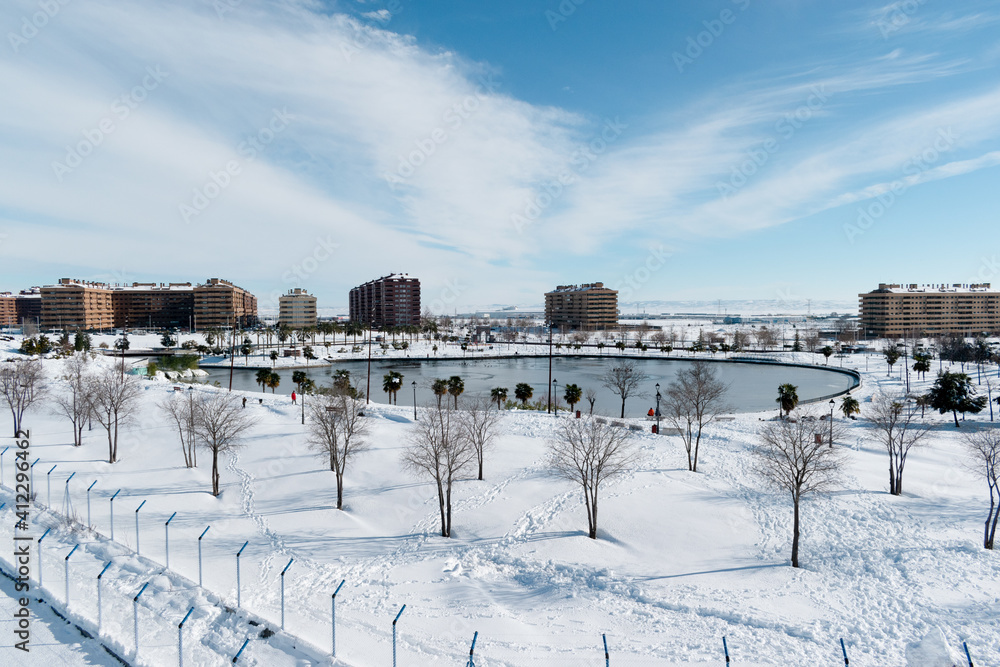 snowy view of maria Audena park with lake in clear day, Quiñon, Toledo, Spain