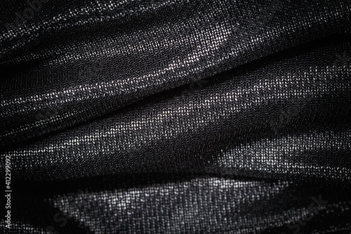 Smooth elegant black silk or satin luxury cloth.