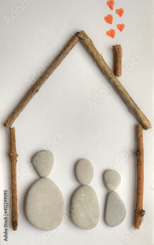 Happy Family Concept with materials, from stones and woods on the white background