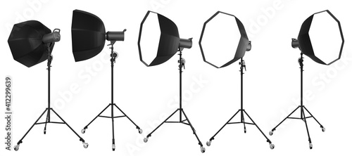 Photo studio lighting stands with flash and octobox isolated on the white.