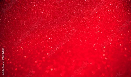 Red background of blurred hearts, side of defocus