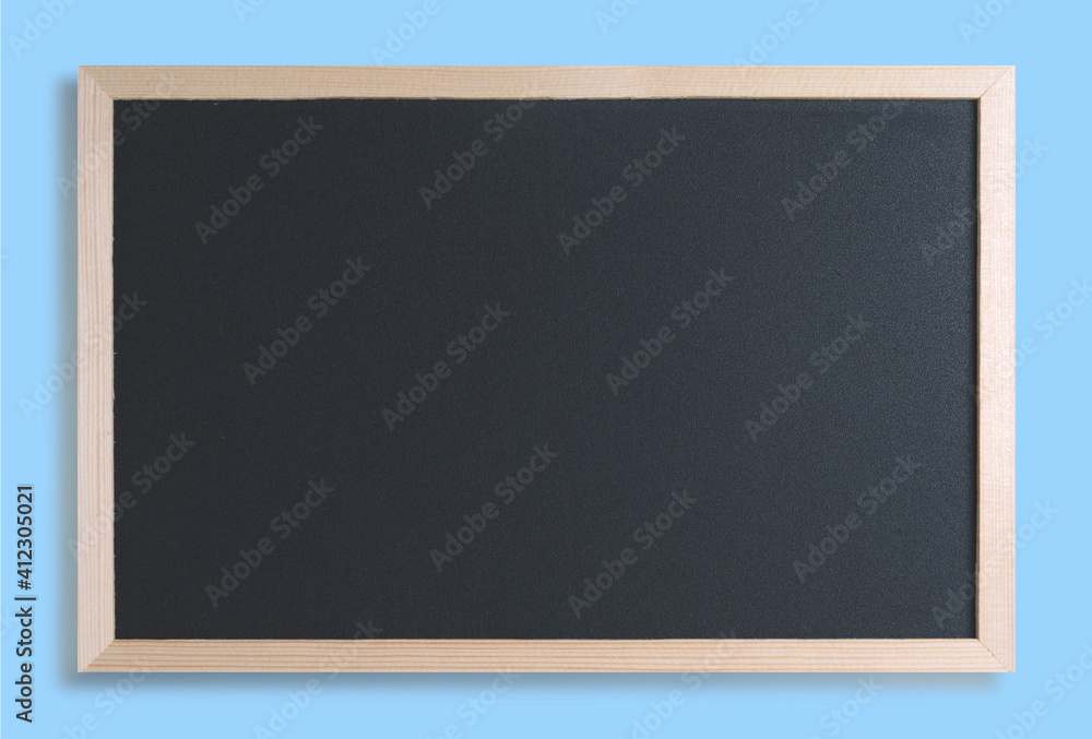 Black chalkboard with wood border and blue background Black chalkboard with wood border and blue background