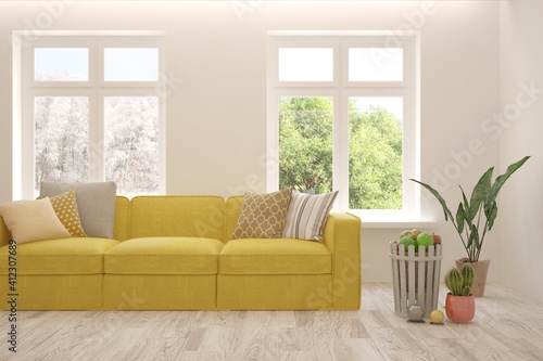 White living room with sofa  summer and winter landscape in window. Scandinavian interior design. 3D illustration