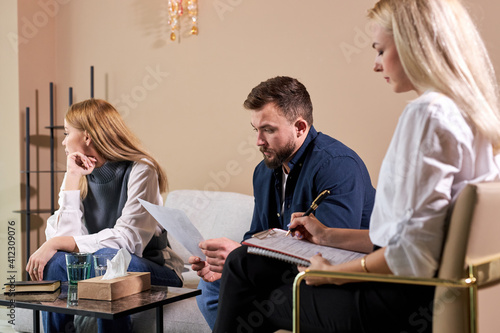 Konstfotografi depressed man and woman sit at psychologist therapy, dissatisfied woman turned a