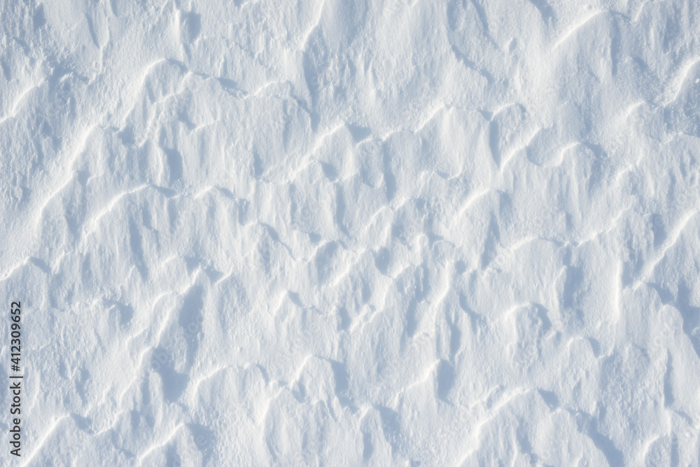 Obraz premium Fresh clean white snow background texture. Winter background with frozen snowflakes and snow mounds. Snow lumps. Seasonal landscape details. Cold weather.