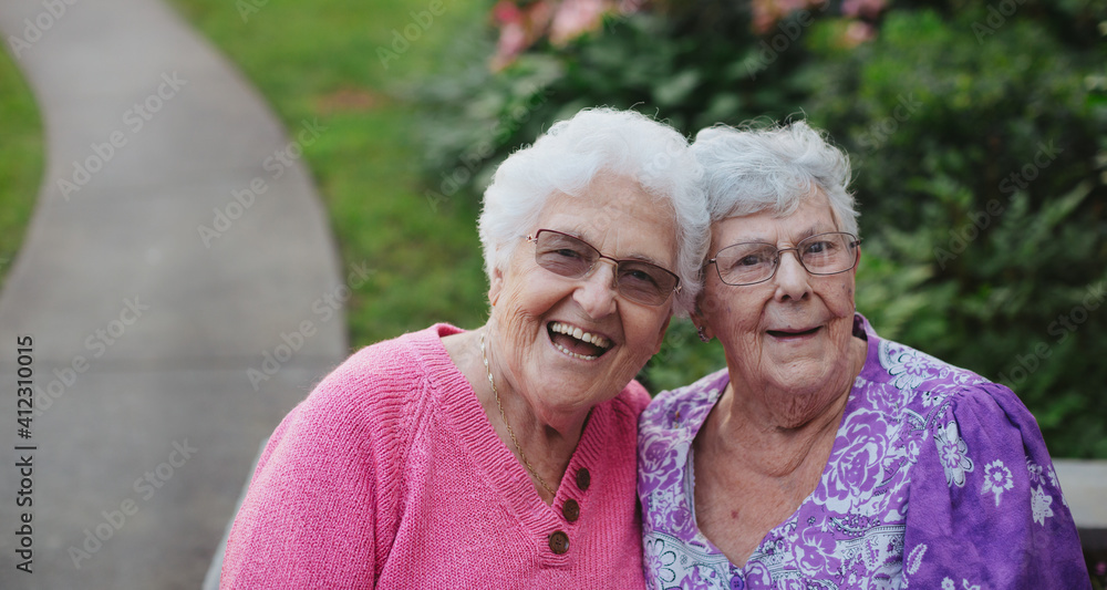 Two senior caucasian friends spending time together outside Two senior caucasian friends spending time together outside