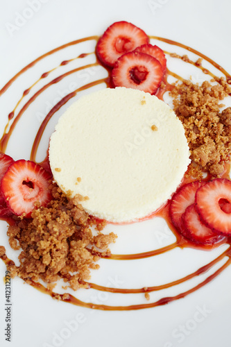 Fromage blanc cheesecake with organic strawberries, graham cracker streusel, balsami photo