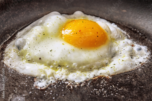 fried egg in a frying pan close up