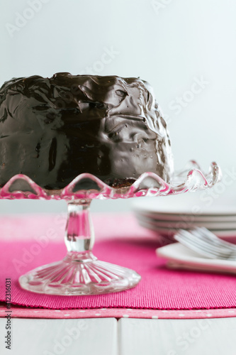 Chocolate ganache coated bundt cake offset photo