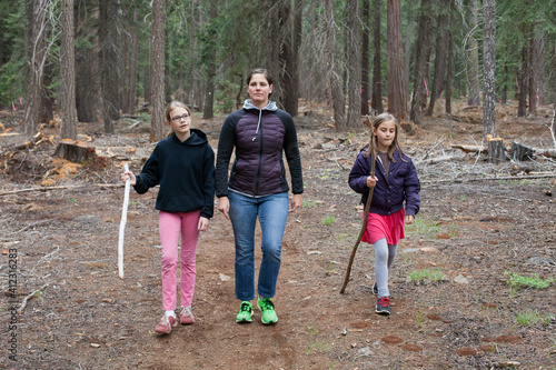 Mom and two daughters hiking on the Pacifc Crest Trail photo