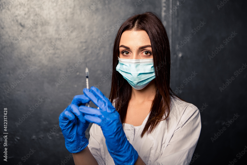 Nurse female doctor hold vaccine injection sprinkles release air