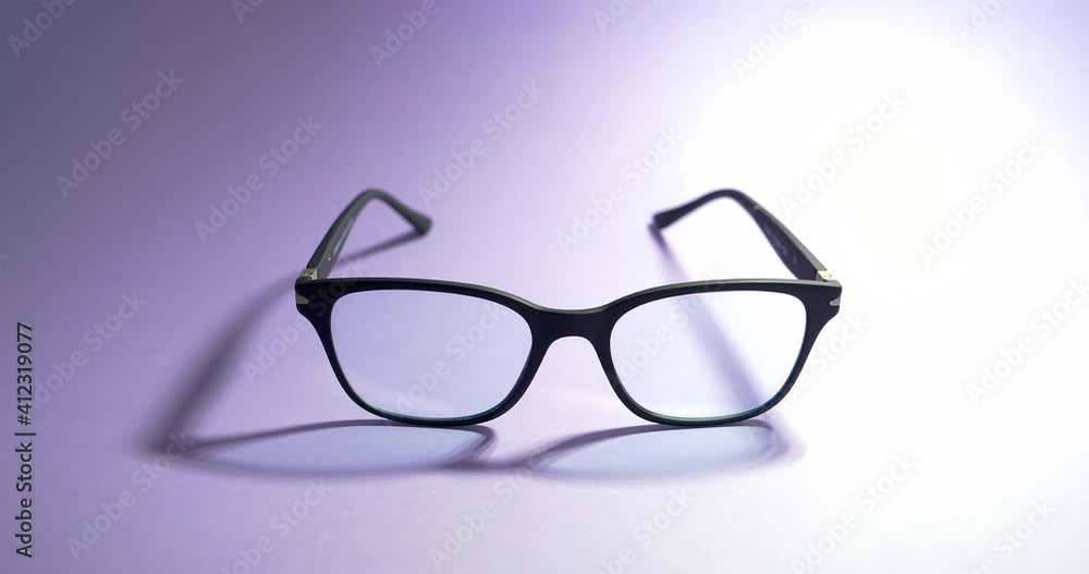 Blue light blocking glasses on the laptop. Black frame glasses for filtering blue light from the computer. Prevent Computer Vision Syndrome. Eye protection from PC screen Blue light blocking glasses on the laptop. Black frame glasses for filtering blue light from the computer. Prevent Computer Vision Syndrome. Eye protection from PC screen