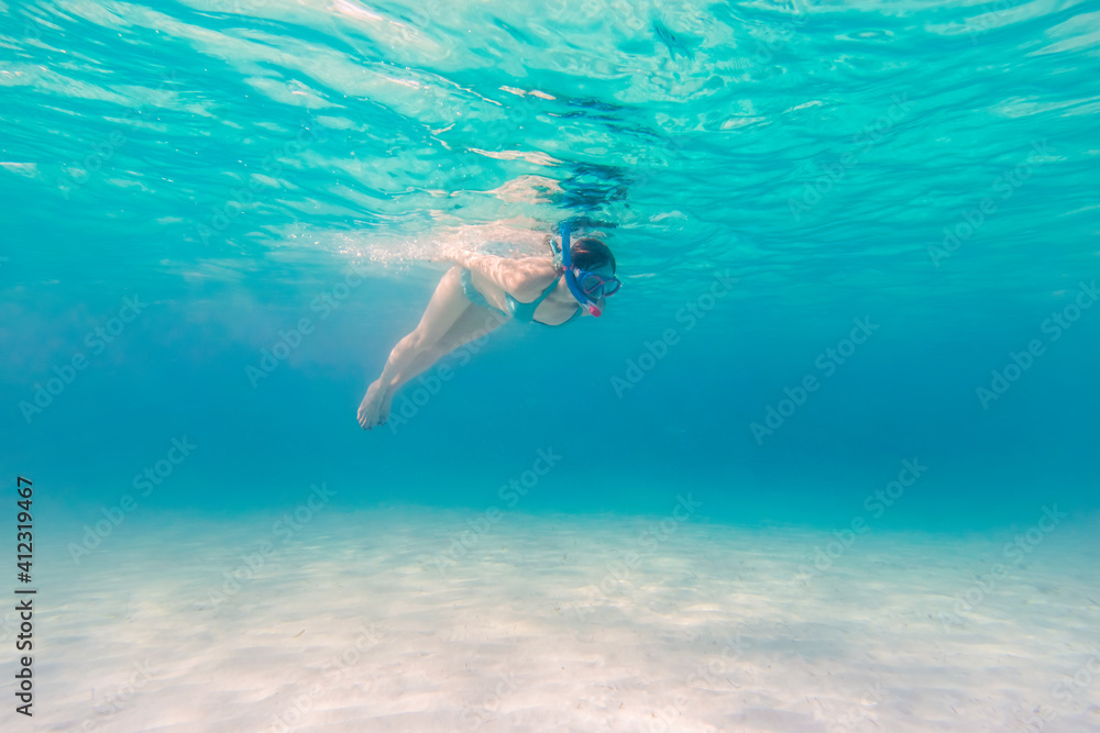Woman Diving Underwater at All Inclusive Caribbean Resort White Sand Beach Woman Diving Underwater at All Inclusive Caribbean Resort White Sand Beach