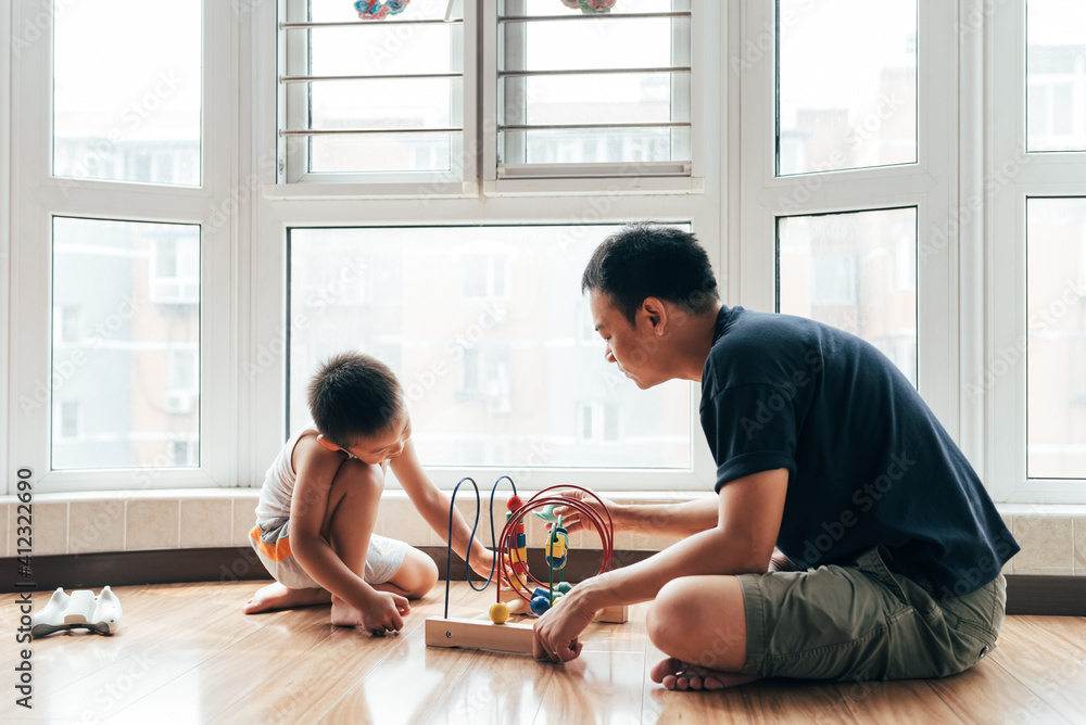 Father and son playing at home Father and son playing at home
