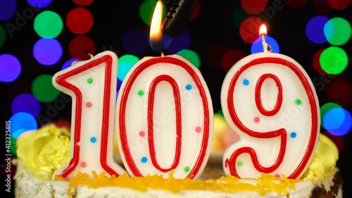 Number 109 Happy Birthday Cake With Burning Candles Topper. photo