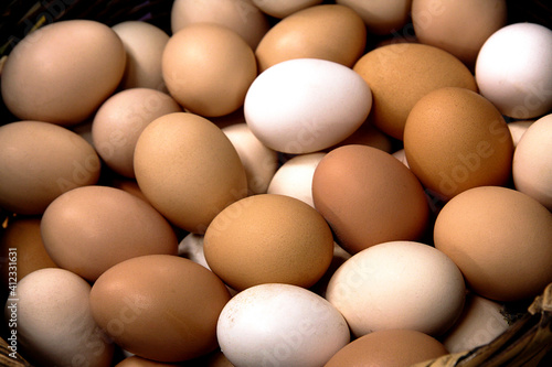 fresh eggs for sale in a market, basket of eggs close up view