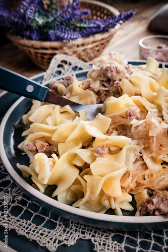 Pasta with sauerkraut and meat. photo