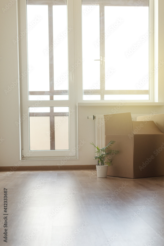 Crop of cartoon boxes on floor at room interior, moving concept Crop of cartoon boxes on floor at room interior, moving concept