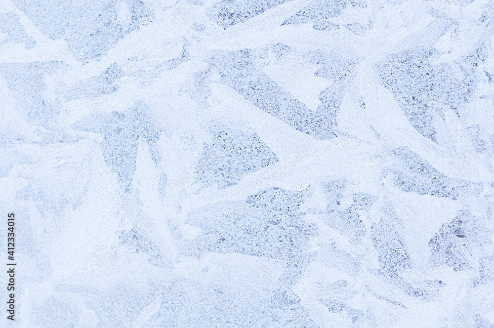 Fototapeta premium Abstract icy white pattern on frozen glass as a background image. Space for text