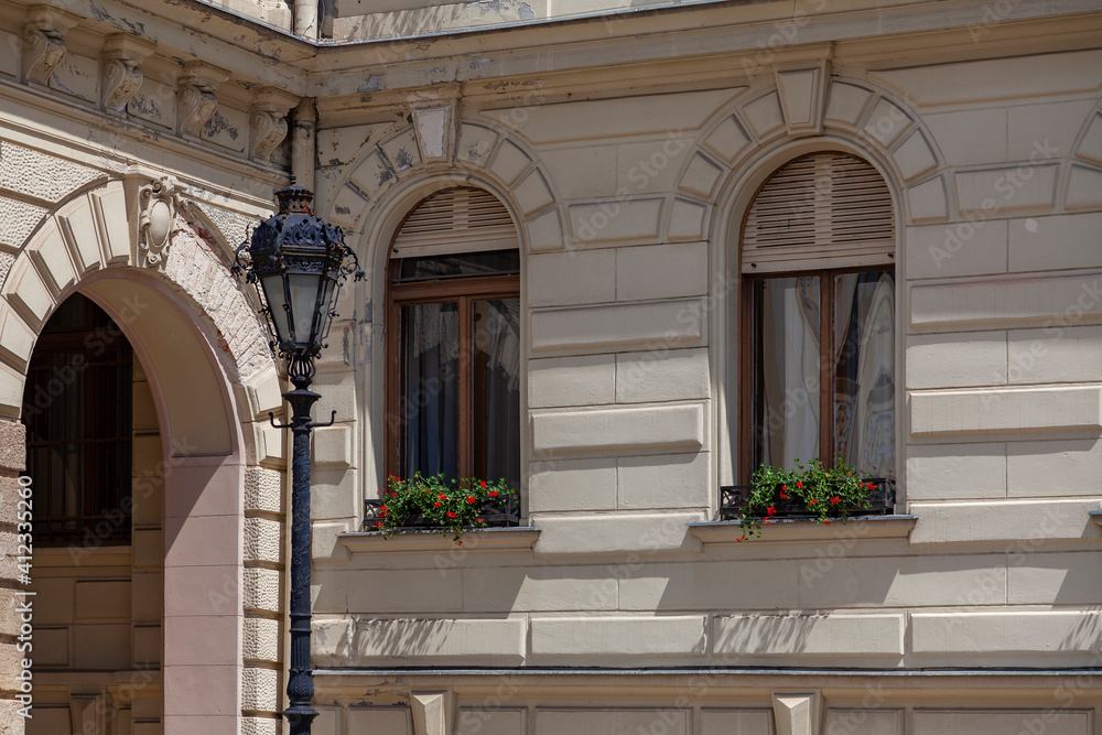 Vintage street lamp stands against the backdrop of the mansion