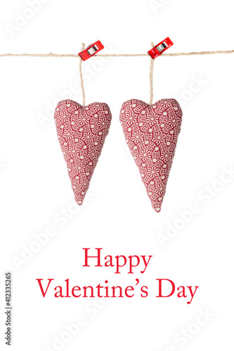 Valenite's card; two hearts hanging, isolated on a white background with text: Happy Valentine's day photo