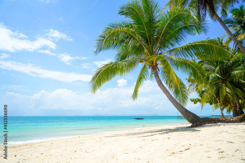 Tropical sea beach with sand and coconut tree in Bangka Belitung. Isolated island clear blue sky background. Ketawai Island
