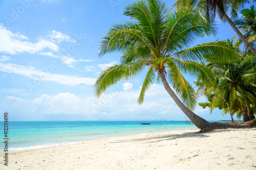 Tropical sea beach with sand and coconut tree in Bangka Belitung. Isolated island clear blue sky background. Ketawai Island