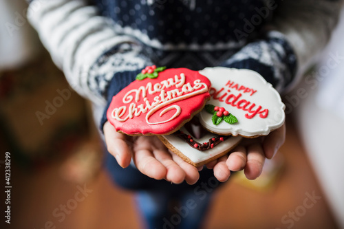 Little girl holding Christmas coookies photo