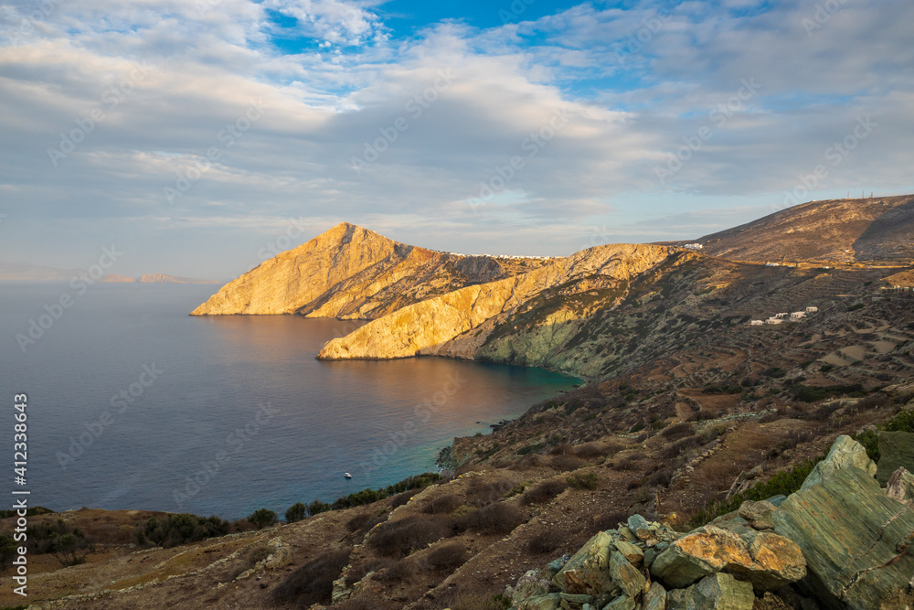 The road on the island of Folegandros at sunset light. Cyclades, Greece The road on the island of Folegandros at sunset light. Cyclades, Greece