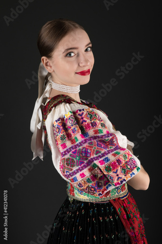 Young beautiful slovak woman in traditional dress. Slovak folklore