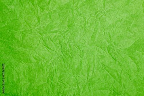 Old crumpled green paper background texture