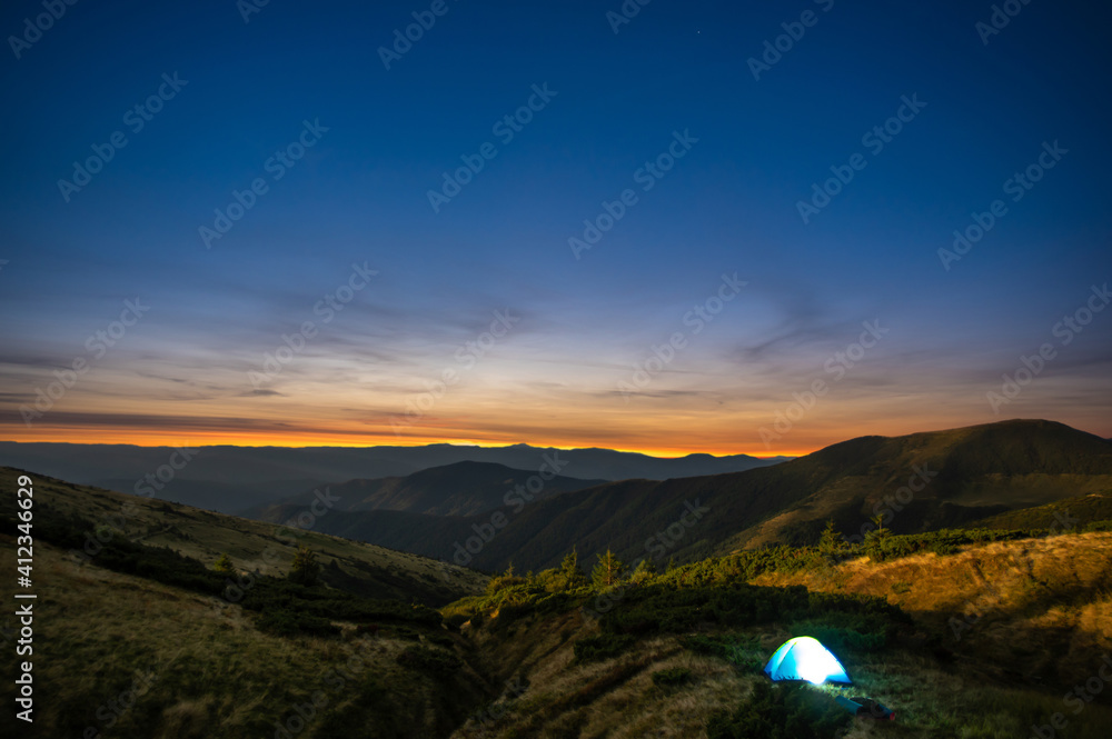 Tent at sunrise in the carpathians
