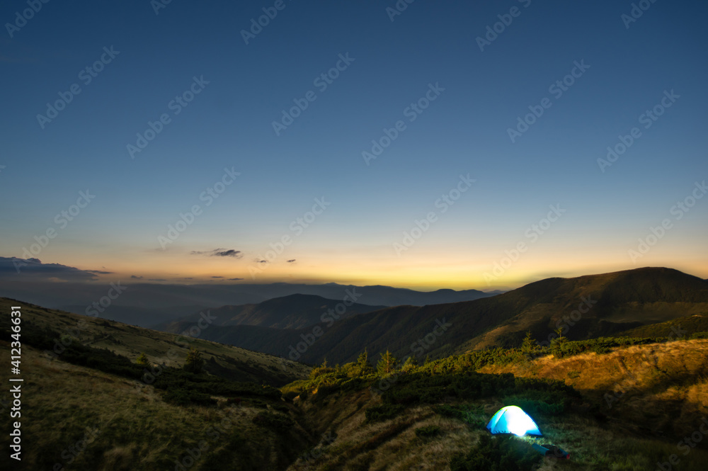Tent at sunrise in the carpathians Tent at sunrise in the carpathians