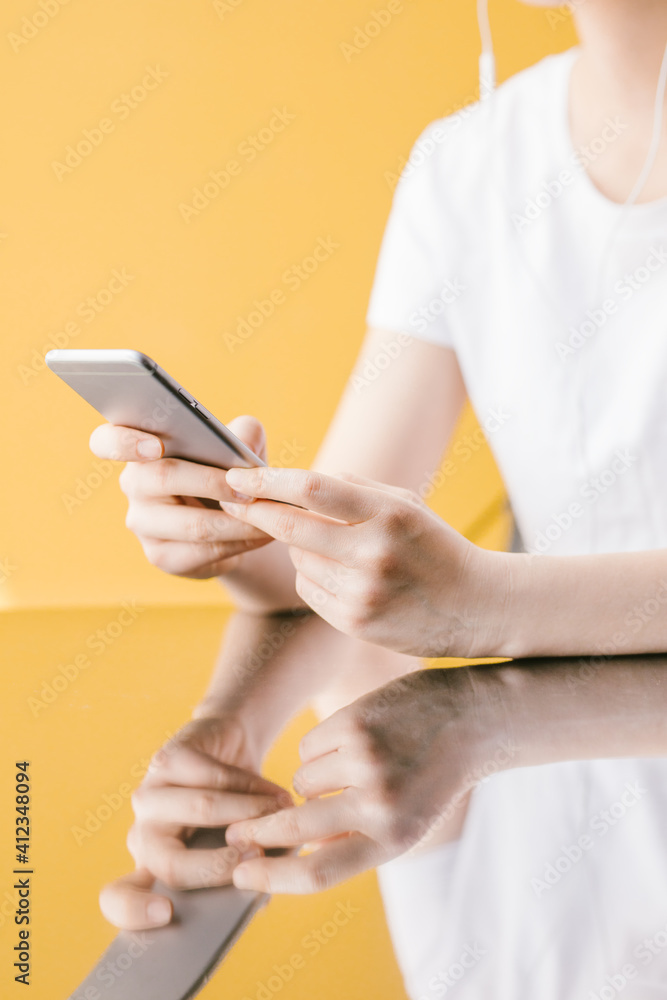 Close up of a woman using her smartphone. Close up of a woman using her smartphone.