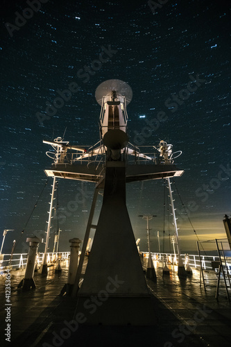 sonar tower on a ferry under starry night sky