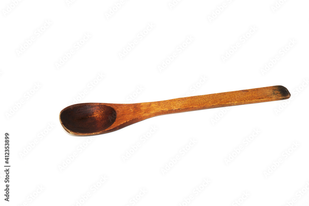 Antique used wooden spoon isolated on white background Antique used wooden spoon isolated on white background