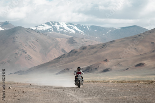 Wallpaper Mural A Motor Biker Travel in a Mountain Valley Torontodigital.ca