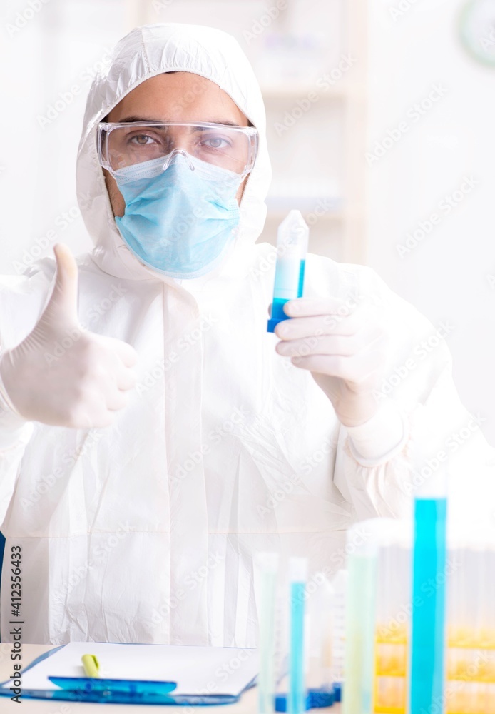 Young chemist student working in lab on chemicals Young chemist student working in lab on chemicals