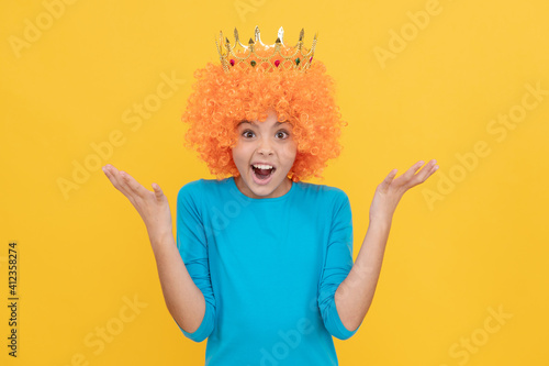 surprised selfish child girl in curly wig and princess diadem, surprise
