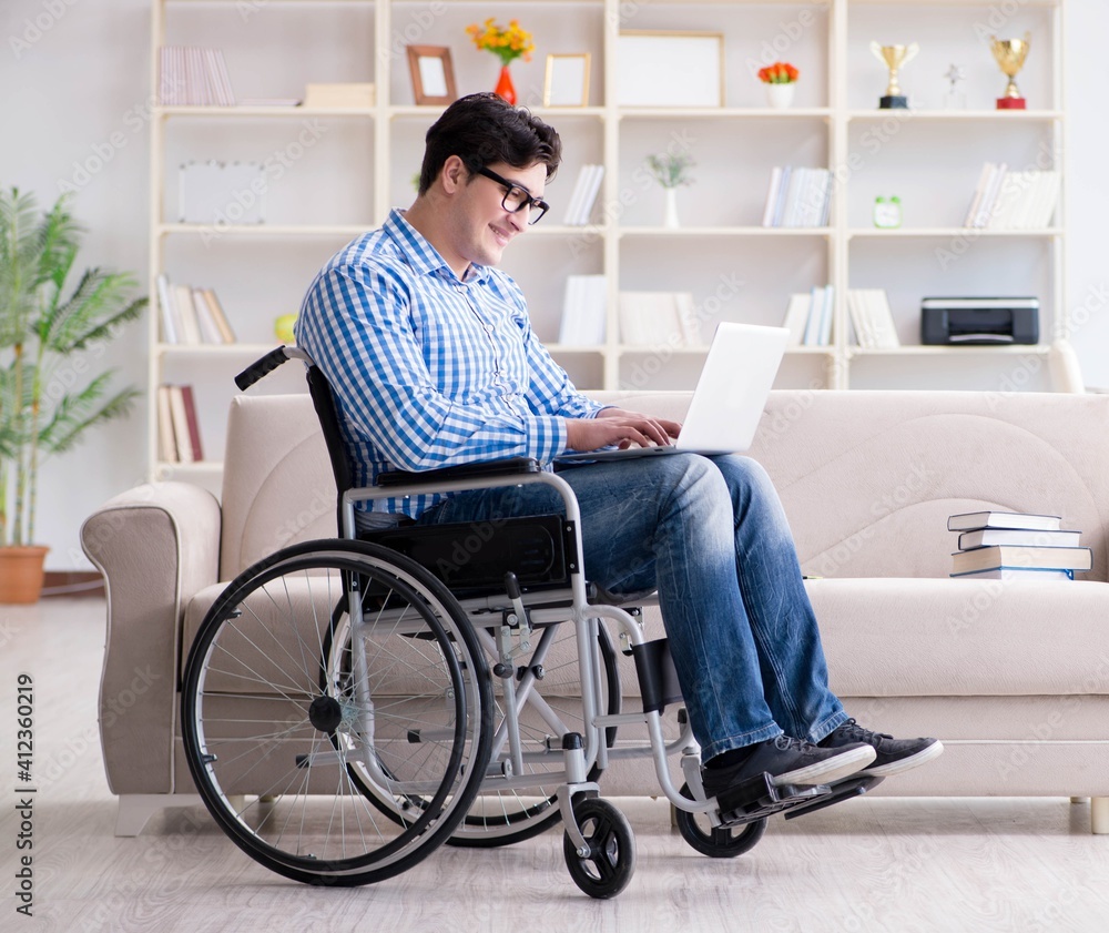 Young student on wheelchair in disability concept Young student on wheelchair in disability concept