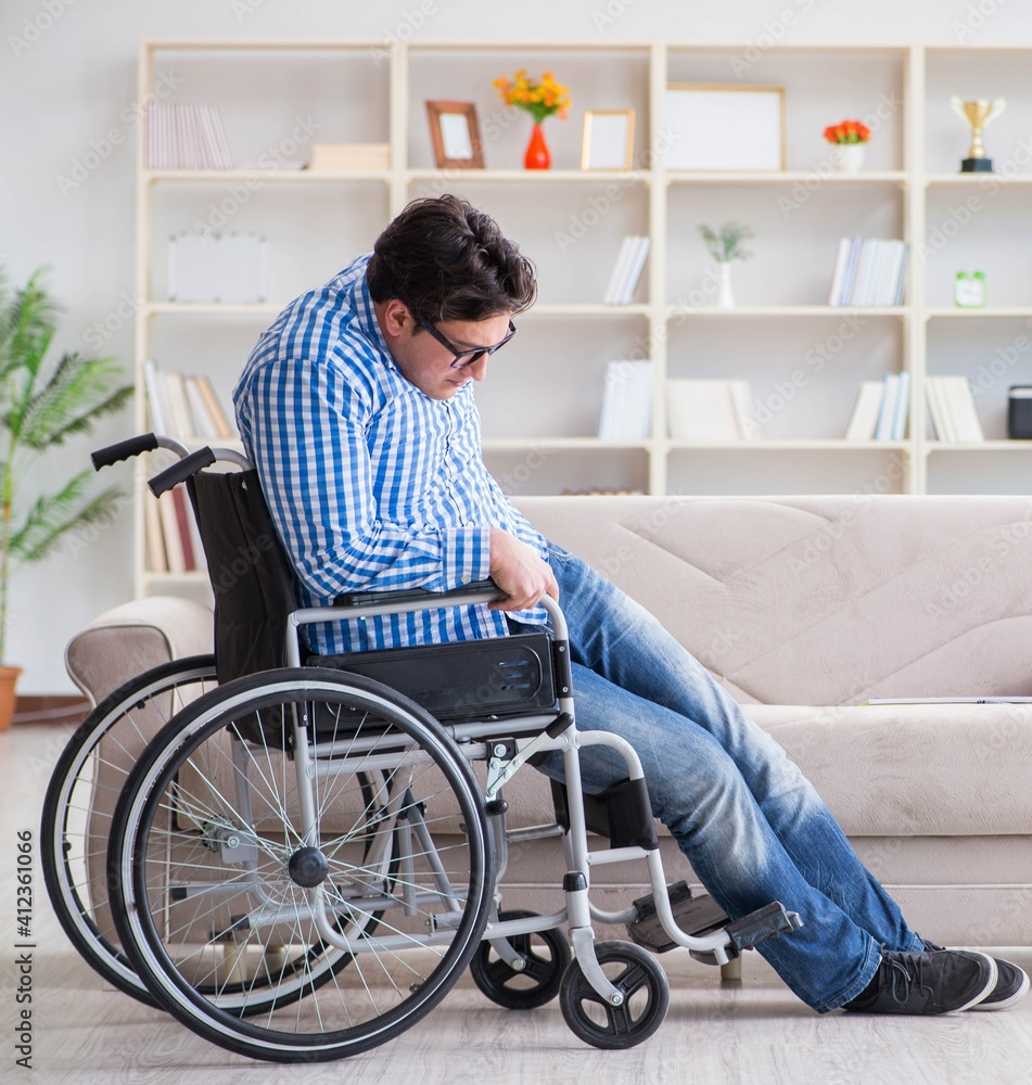 Young student on wheelchair in disability concept Young student on wheelchair in disability concept