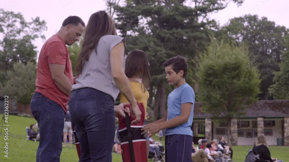 A Family with Children Arrive at Park for Outdoor Event in Glen Cove Long Island A Family with Children Arrive at Park for Outdoor Event in Glen Cove Long Island