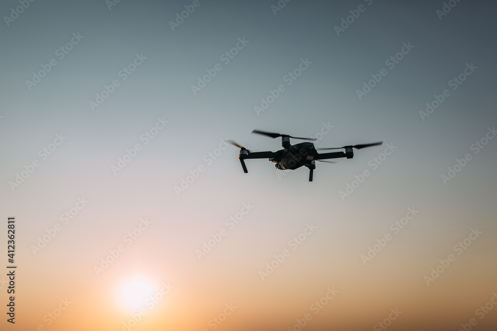Drone on the sky at sunset Drone on the sky at sunset