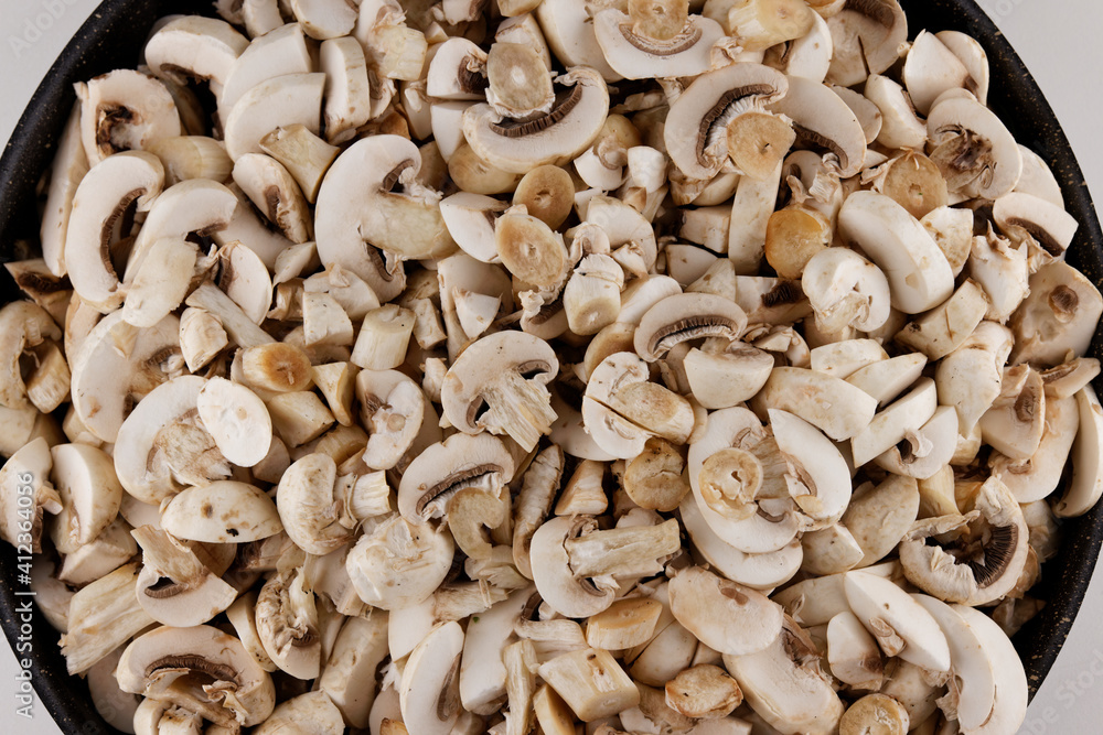 sliced fresh mushrooms in a pot sliced fresh mushrooms in a pot