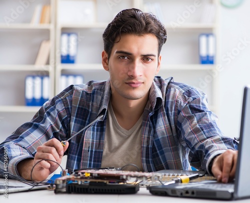 Computer hardware repair and fixing concept by experienced techn photo